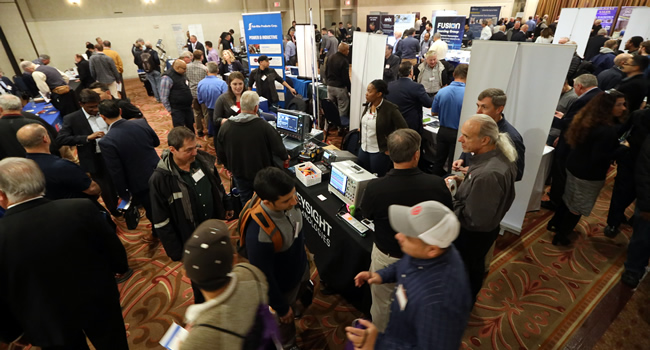 A packed exhibit floor at the 2023 IEEE LI Power Electronics Symposium