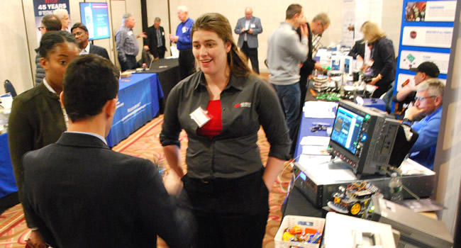 A packed exhibit floor at the 2023 IEEE LI Power Electronics Symposium