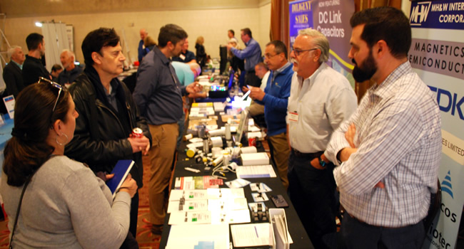 A packed exhibit floor at the 2023 IEEE LI Power Electronics Symposium