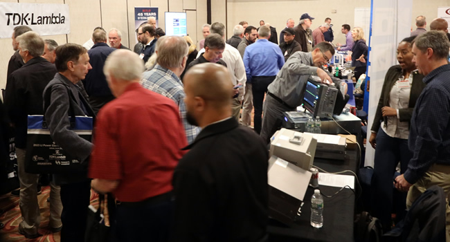 A packed exhibit floor at the 2023 IEEE LI Power Electronics Symposium