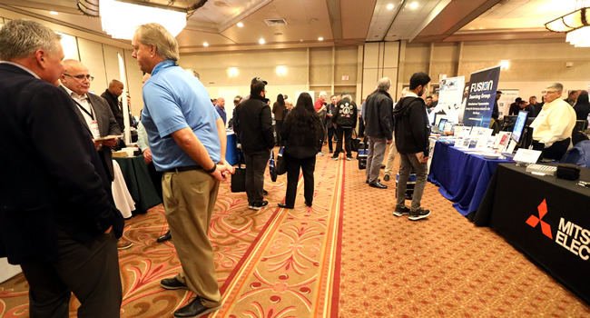 A packed exhibit floor at the 2023 IEEE LI Power Electronics Symposium